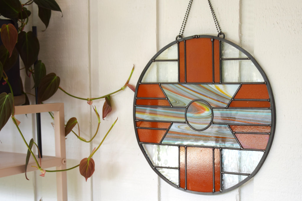 Sedona handmade stained glass window panel in warm desert red and amber
