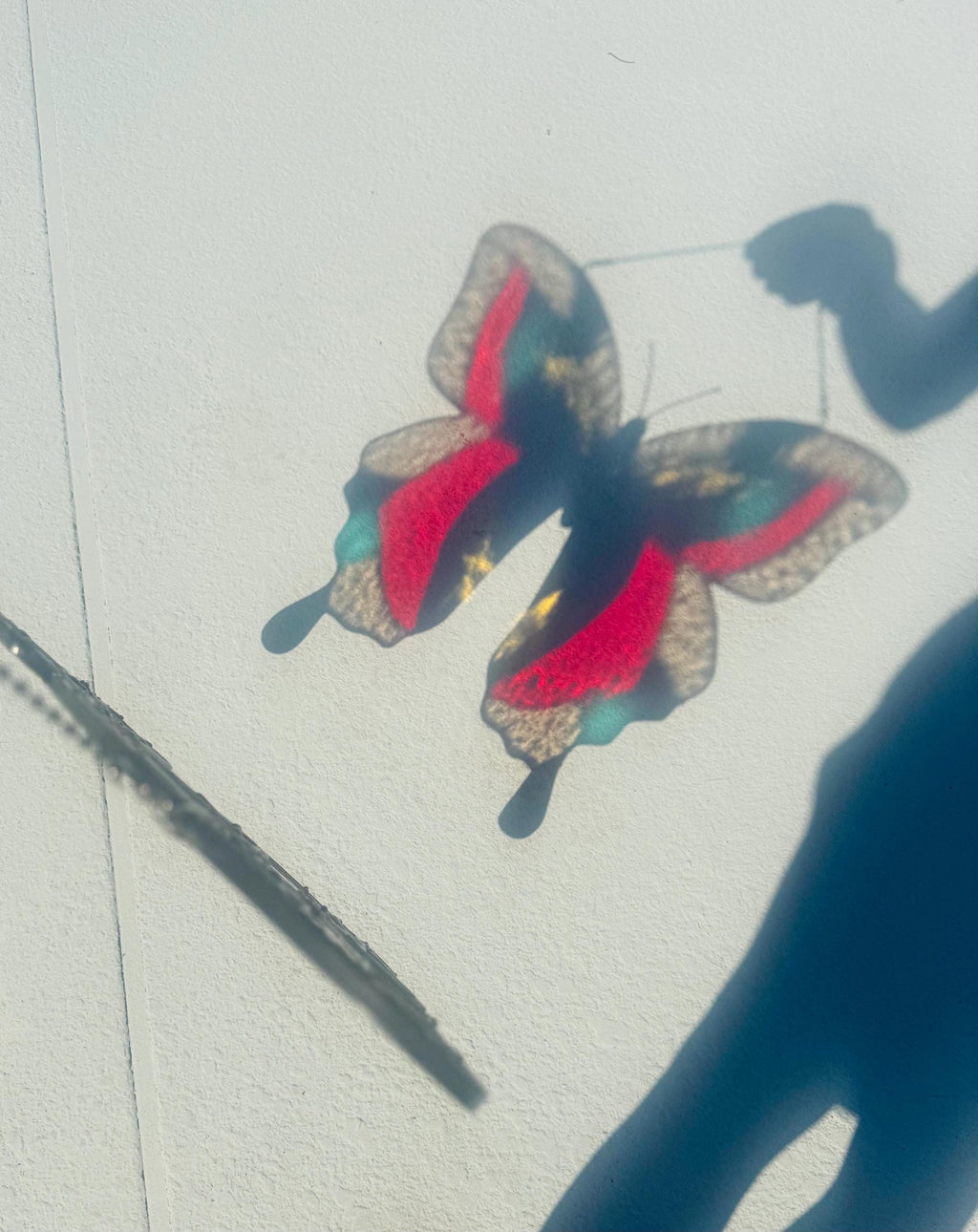Large handmade stained glass butterfly suncatcher with bold color wings
